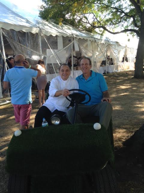 JEAN-GEORGES VONGERICHTEN and Michael Lehrer owner of Home Green Advantage touring the festival in Lehrer's turf covered golf cart s